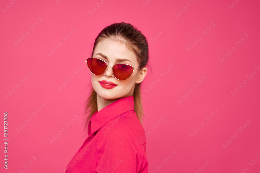 Woman in pink shirt and brown glasses cropped view fashion model emotions gesturing hands portrait Woman in pink shirt and brown glasses cropped view fashion model emotions gesturing hands portrait