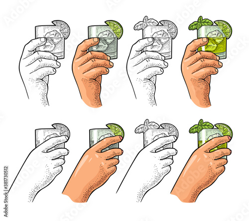 Hands holding glass cocktail gin with basil and lime. Vintage vector engraving