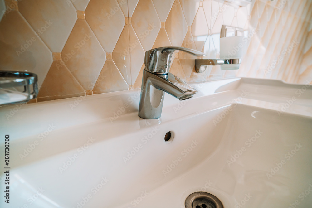 Fototapeta premium Bathroom sink with faucet close-up