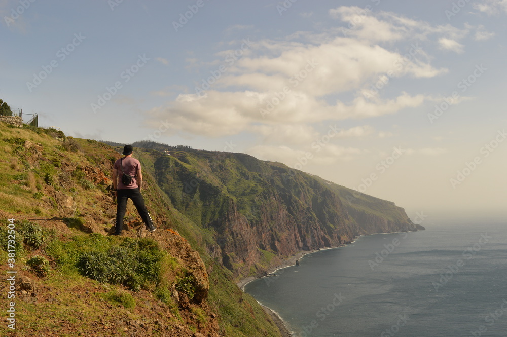 Hiking along the coast, by the waterfalls and in the green levadas of Madeira Island in Portugal Hiking along the coast, by the waterfalls and in the green levadas of Madeira Island in Portugal