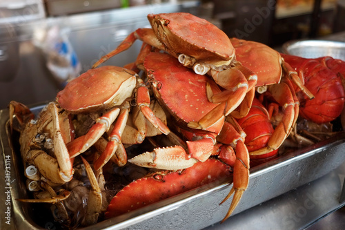 Dungeness crab (metacarcinus magister) seafood steamed. Traditional US west coast, of pacific ocean waters, street food at San Francisco fisherman's wharf pier tourist attraction destination.