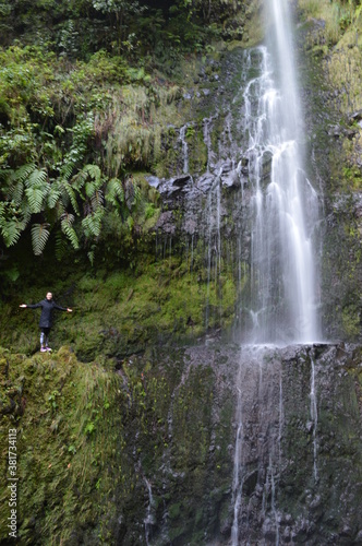 Hiking on the green paths of the levadas and waterfalls on Madeira Island in Portugal