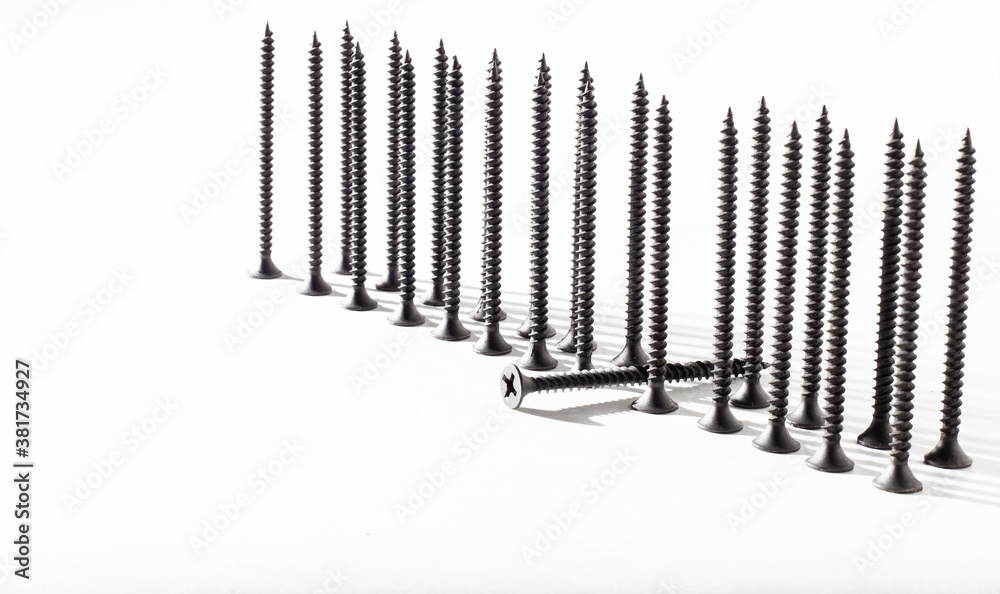 Screw on a white background close-up. Self-tapping screw in golden yellow color for wood, chipboard or plywood with a large head. Screw on a white background close-up. Self-tapping screw in golden yellow color for wood, chipboard or plywood with a large head.