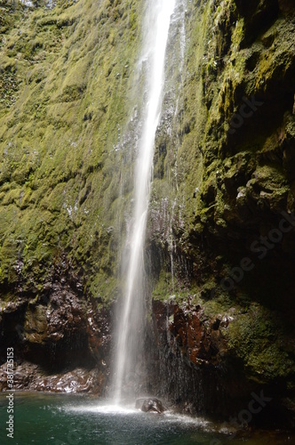 Fototapeta Naklejka Na Ścianę i Meble -  Hiking on the green paths of the levadas and waterfalls on Madeira Island in Portugal