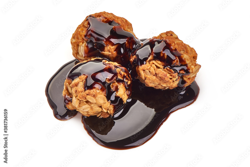 Homemade oat cookies with chocolate syrup, isolated on white background Homemade oat cookies with chocolate syrup, isolated on white background