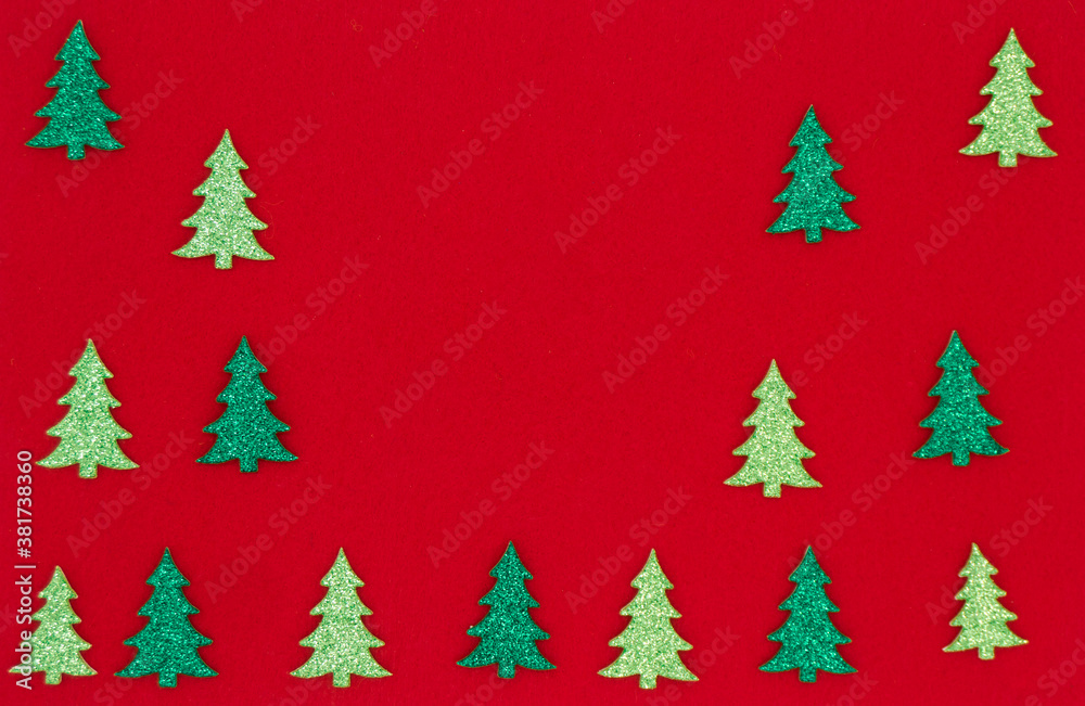 Shiny, dark green and light green Christmas trees on a red background. New year 2021. Merry Christmas. Card. Banner