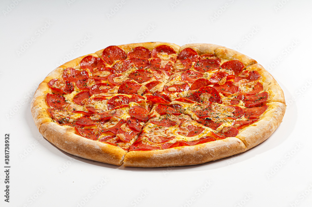 Pepperoni pizza on white background. Copy space. Selective focus