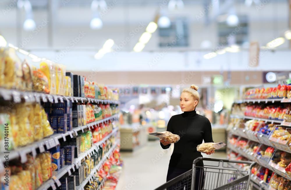 Woman choosing a dairy products at supermarket	