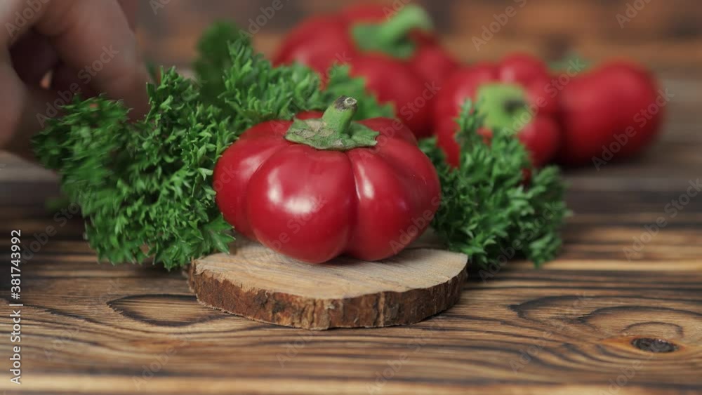 pepper and parsley on a wooden background pepper and parsley on a wooden background