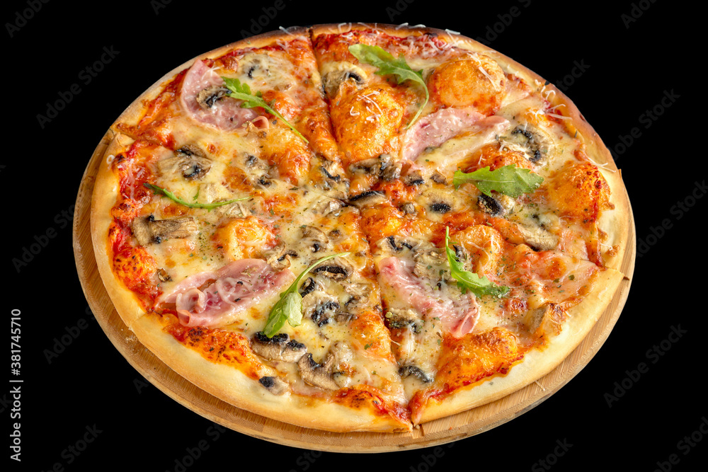 Pizza with ham and mushrooms on a thin crust. Black background.