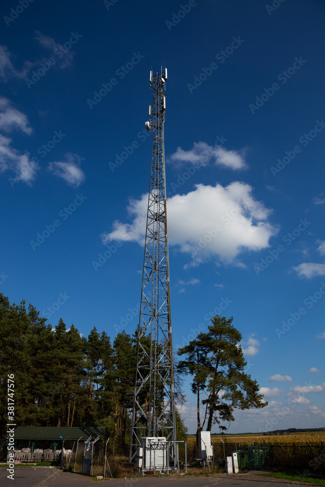 Mast of the cellular  network over the blue sky