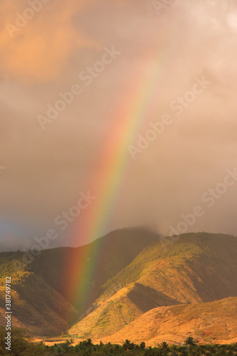 Stunning rainbow at sunset with nrainbow over the west maui mountains,