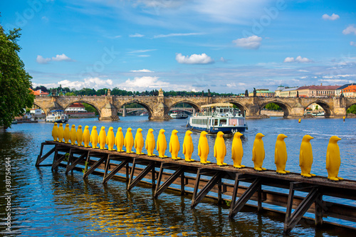 Art object march of yellow penguins. Weird art statues of Prague