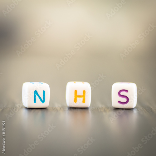 NHS - National Health System word on colourful dices photo