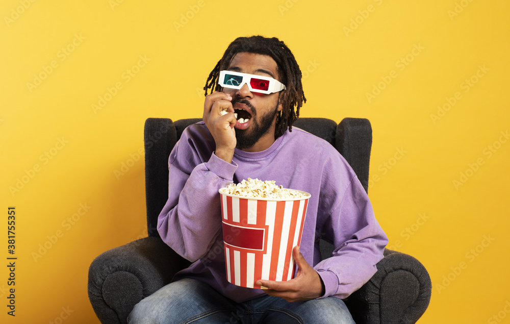 Boy has fun watching a film. concept of entertainment and streaming tv Boy has fun watching a film. concept of entertainment and streaming tv