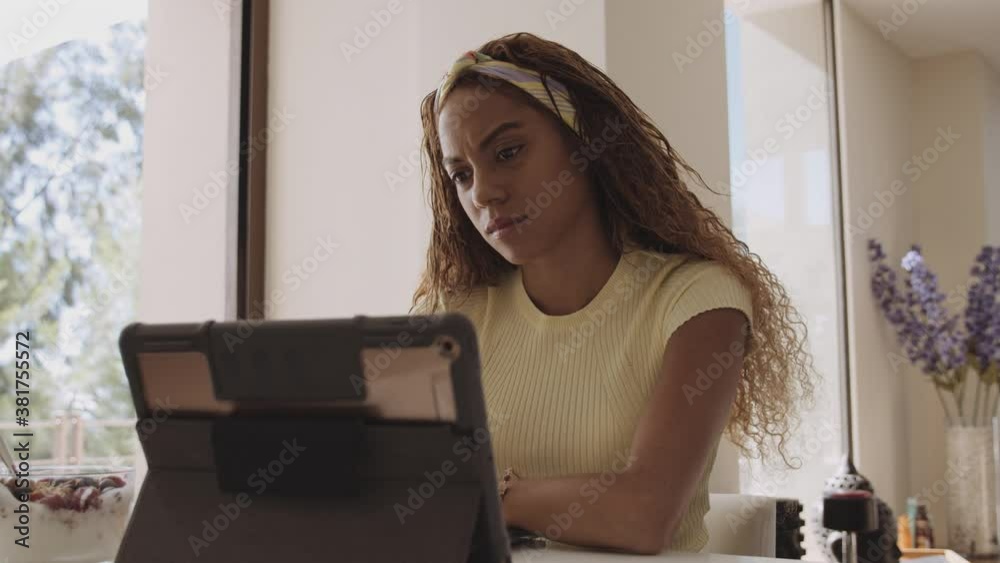 Female College Attending Online Class While Sitting in Well-Lit Room Female College Attending Online Class While Sitting in Well-Lit Room