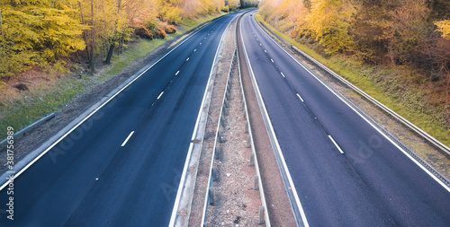 Empty dual motorway in UK - lockdown affects not only road traffic and transportation but also petrol prices