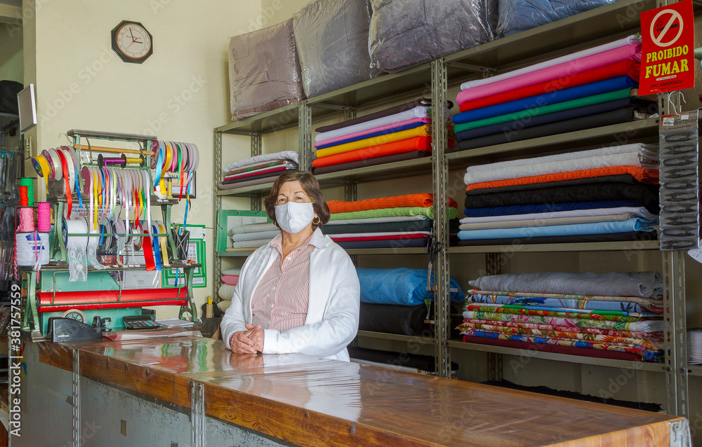 Brazilian trader poses with protective mask against Covid-19 in his store in Guarani, Minas Gerais, Brazil.