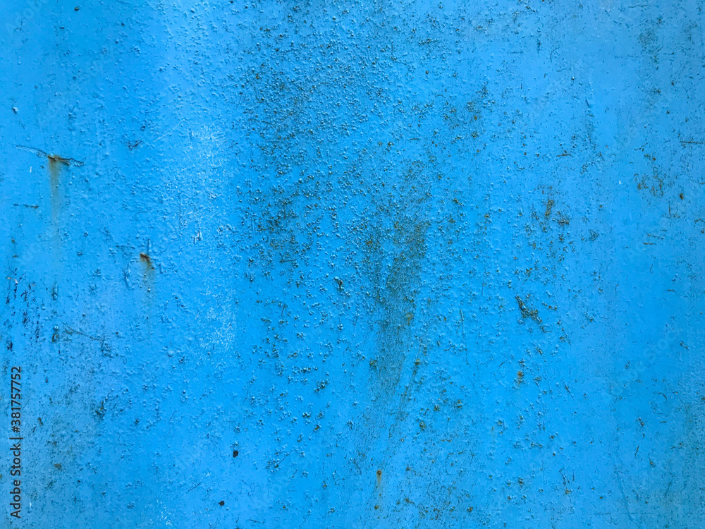 texture in blue. bright, matte surface of unusual color. metal sheet with paint smudges, damage, corrosion and rust. home decoration, decor, paint walls and home texture in blue. bright, matte surface of unusual color. metal sheet with paint smudges, damage, corrosion and rust. home decoration, decor, paint walls and home
