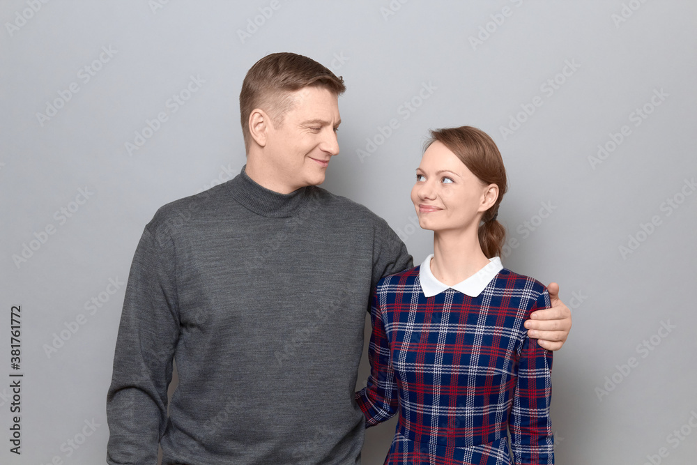 Portrait of happy man and woman hugging and looking at each other Portrait of happy man and woman hugging and looking at each other