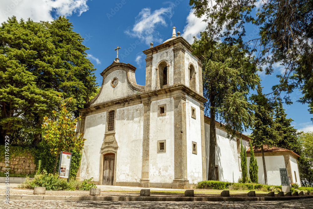 Church of Santa Maria do Castelo in Castelo Branco, Portugal, seen in perspective and lit by the sun of a summer day.