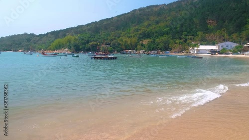 fishing boats on the beach on sunny day