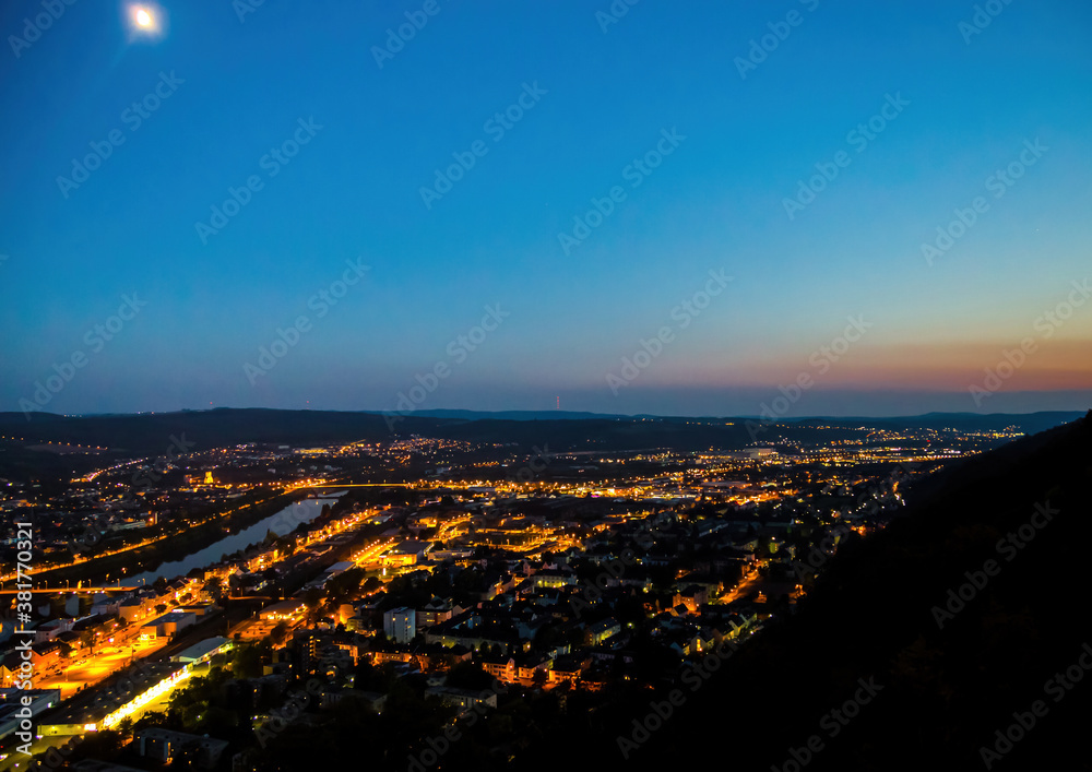 Night shot of the illuminated old German city of Trier, photographed from a hill