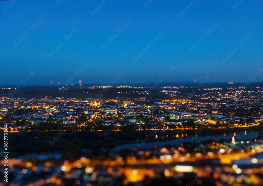 Obraz premium Night shot of the illuminated old German city of Trier, photographed from a hill