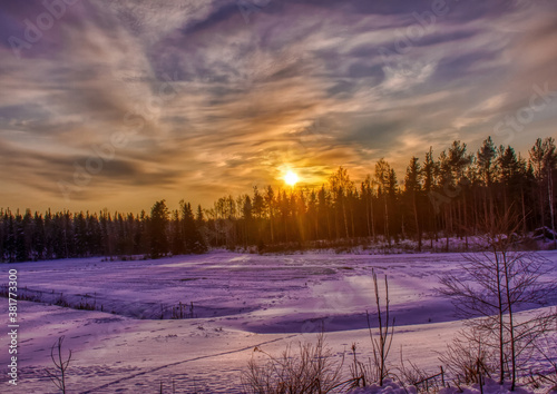 Pictures of a sunset over a forest near the Finnish town of Rauma