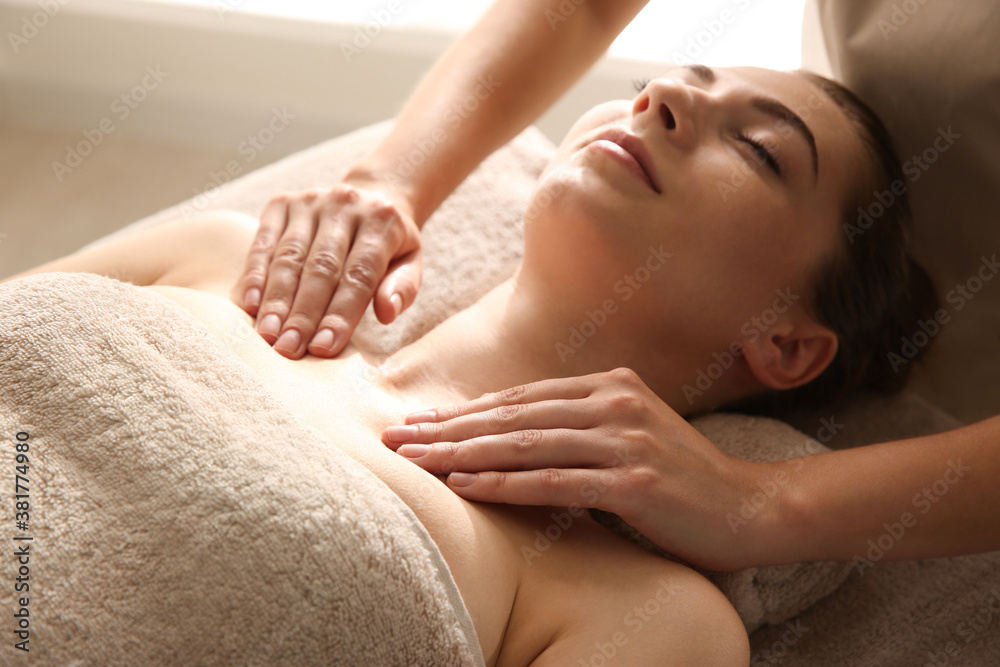 Young woman receiving body massage in spa salon Young woman receiving body massage in spa salon