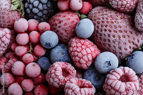 Mix of different frozen berries as background  top view