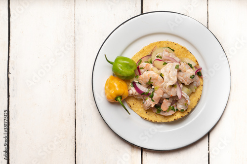 Mexican shrimp raw aguachile on white background photo