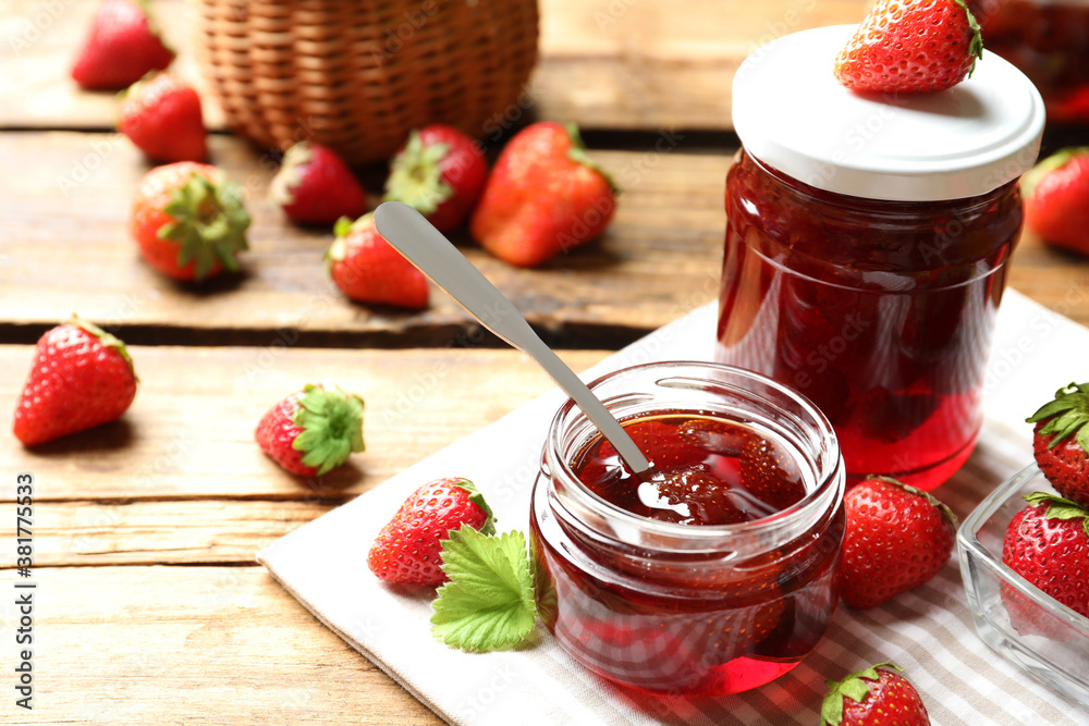 Delicious pickled strawberry jam and fresh berries on wooden table Delicious pickled strawberry jam and fresh berries on wooden table