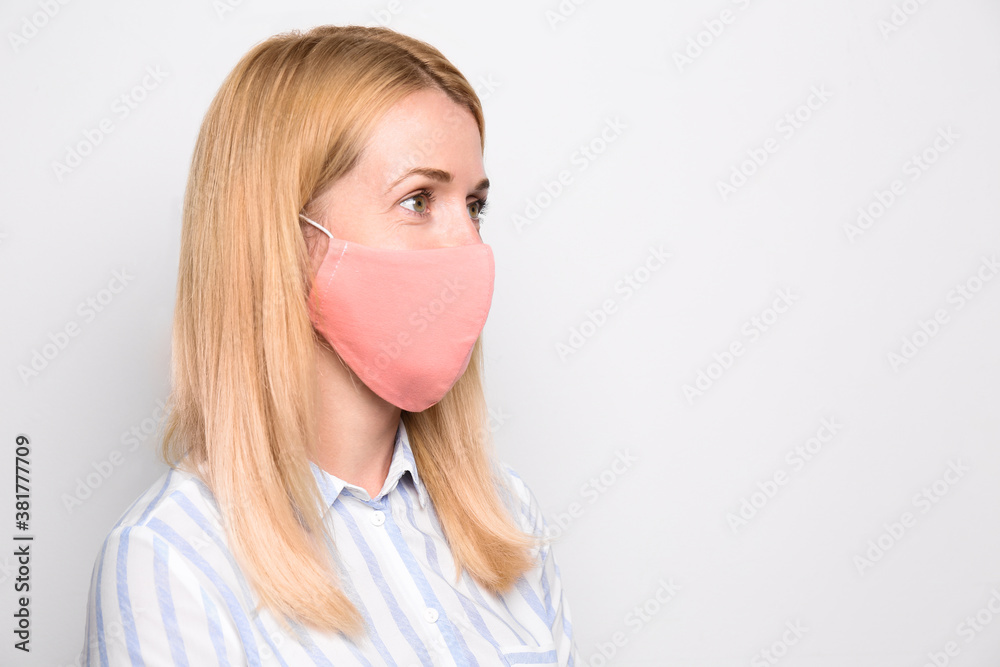 Woman wearing handmade cloth mask on white background, space for text. Personal protective equipment during COVID-19 pandemic Woman wearing handmade cloth mask on white background, space for text. Personal protective equipment during COVID-19 pandemic