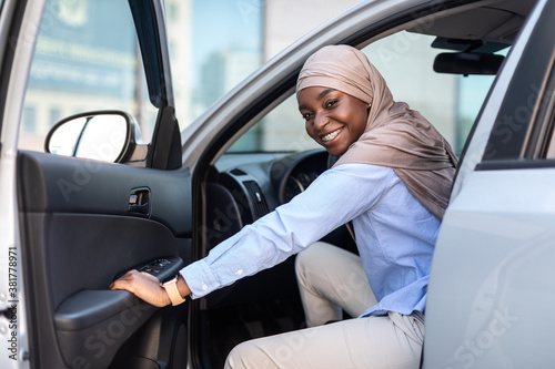 New Car. Happy black muslim businesswoman getting in luxury auto and smiling © Prostock-studio