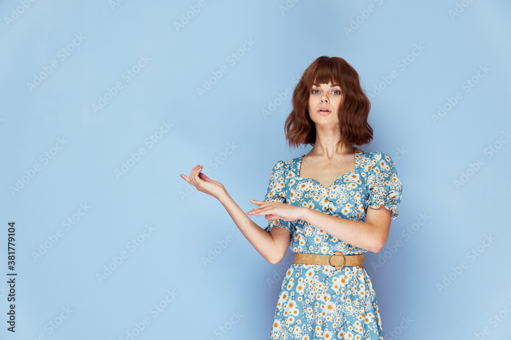 Beautiful woman Shows a look ahead with a finger to the side summer clothes Beautiful woman Shows a look ahead with a finger to the side summer clothes