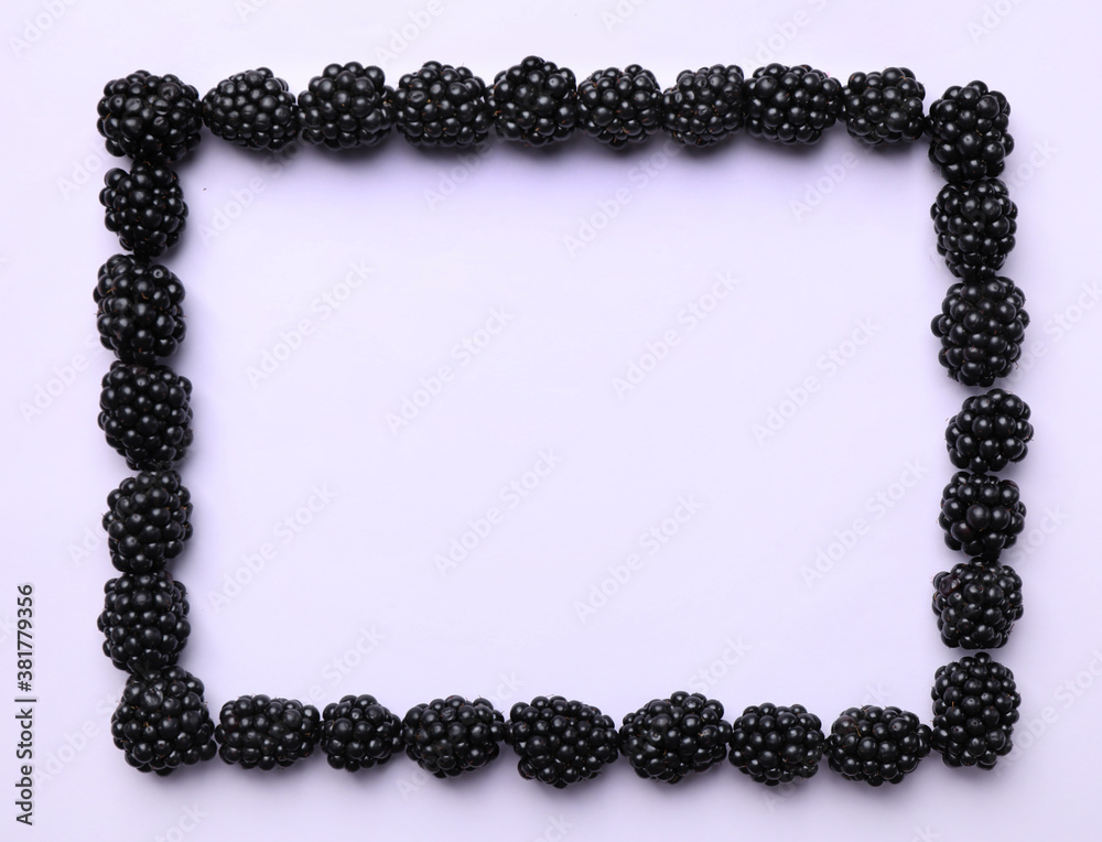 Frame of ripe blackberries on white background, flat lay. Space for text Frame of ripe blackberries on white background, flat lay. Space for text