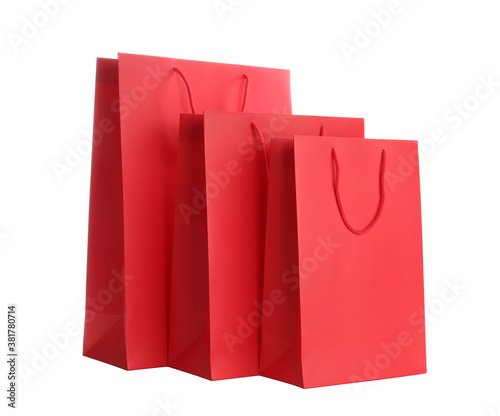 Red paper shopping bags isolated on white
