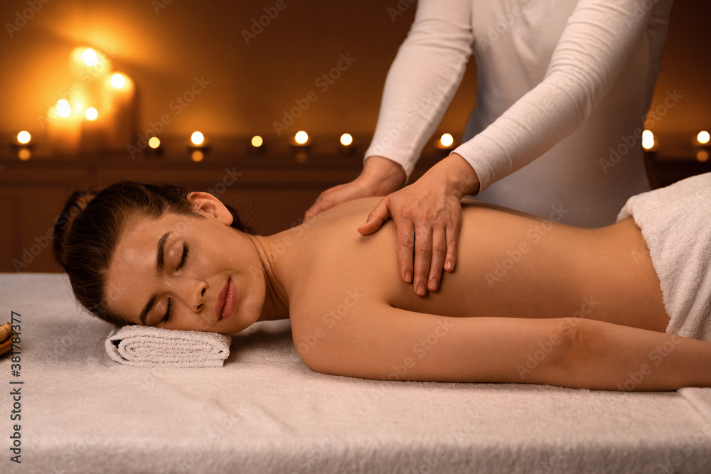 Fototapeta premium Woman having body massage session at modern spa