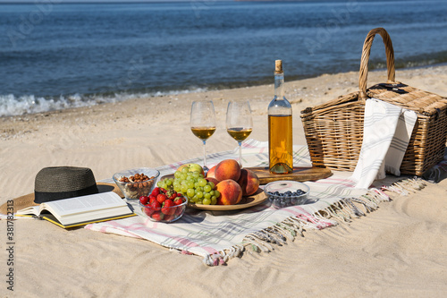 Food and wine on beach. Summer picnic © New Africa