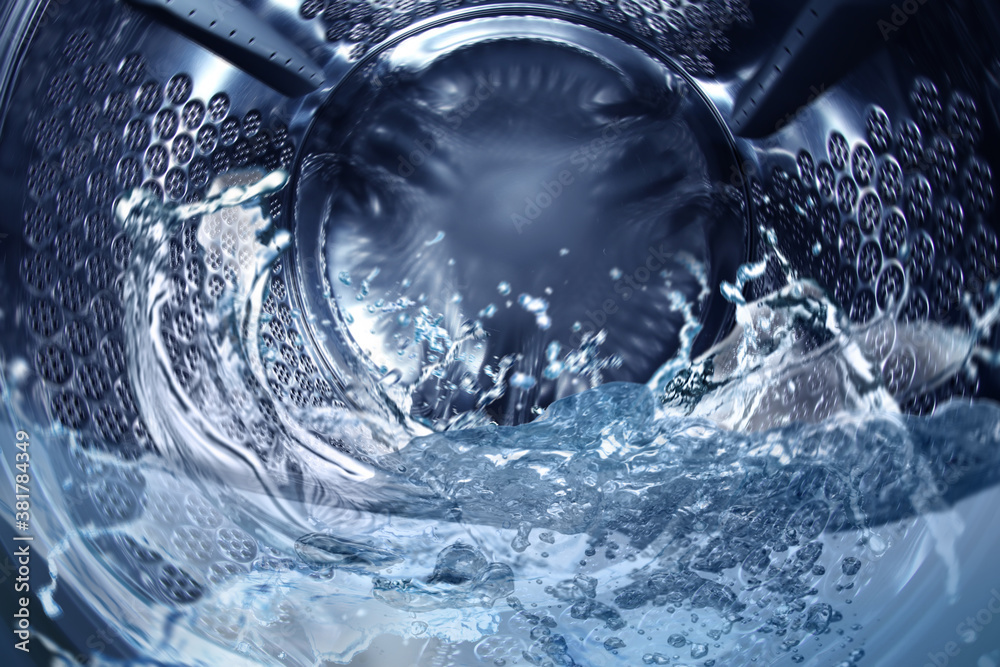 Washing machine drum with water, closeup view Washing machine drum with water, closeup view