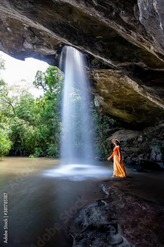 Woman standing in Saeng Chan Waterfall at Pha Taem National Park  Ubon Ratchathani  Thailand.