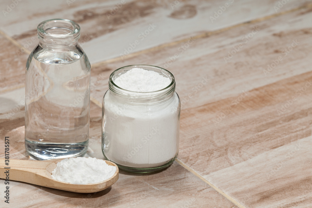 Baking soda - sodium bicarbonate and vinegar, photo on the house floor. Baking soda - sodium bicarbonate and vinegar, photo on the house floor.