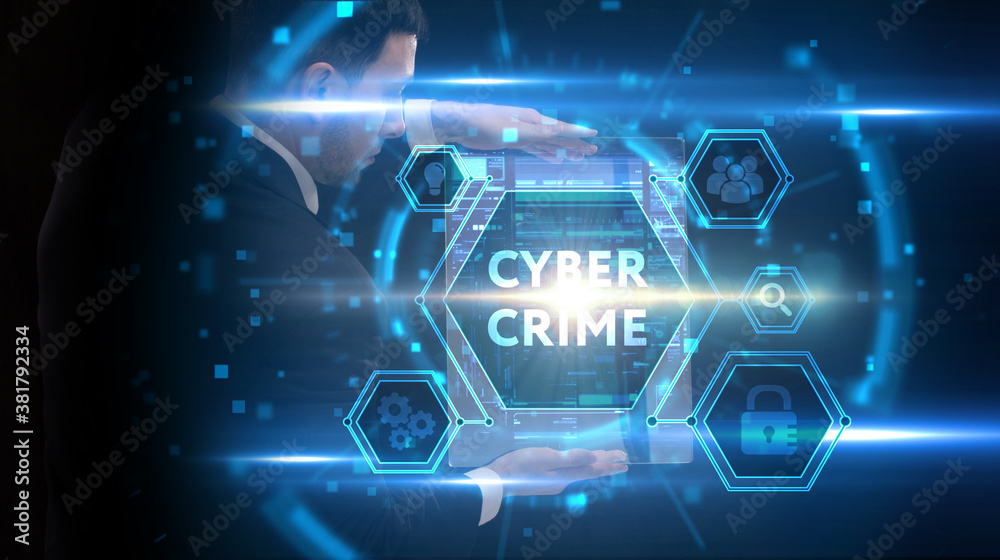 Naklejka premium Business, Technology, Internet and network concept. Young businessman working on a virtual screen of the future and sees the inscription: Cyber crime