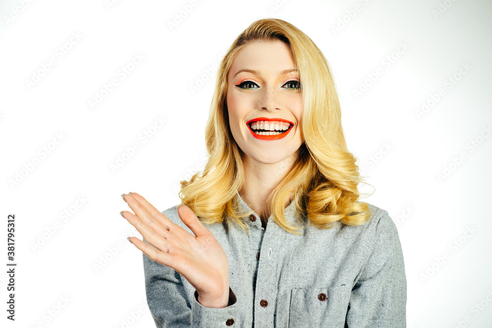Beauty smiling pinup girl on white isolated background. Studio shot on white background. Beauty smiling pinup girl on white isolated background. Studio shot on white background.