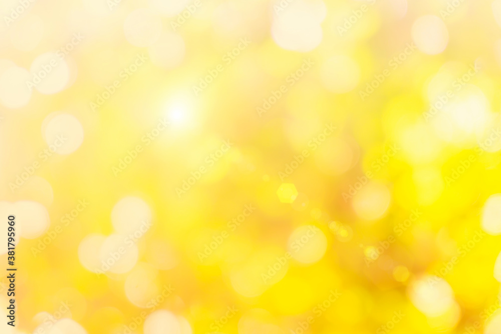 Natural yellow background blurring warm colors and bright gold sunlight. Bokeh or Christmas background at sky sunny color orange light patterns plain abstract flare evening clouds blur. Natural yellow background blurring warm colors and bright gold sunlight. Bokeh or Christmas background at sky sunny color orange light patterns plain abstract flare evening clouds blur.