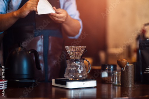 Measuring coffee drip with glass mug
