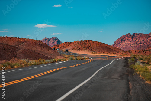 American roadtrip. Natural american landscape with asphalt road to horizon.