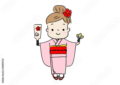 お正月　着物を着て羽子板を遊びをしている女の子