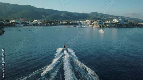 Stunning drone footage in 4k of person wakeboarding in Mallorca - Palmanova beach - Magaluf - Waterskiing - Activities outdoor, Mediterranean Sea, Belearic Islands, Spain photo